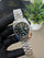 Silver with green dial